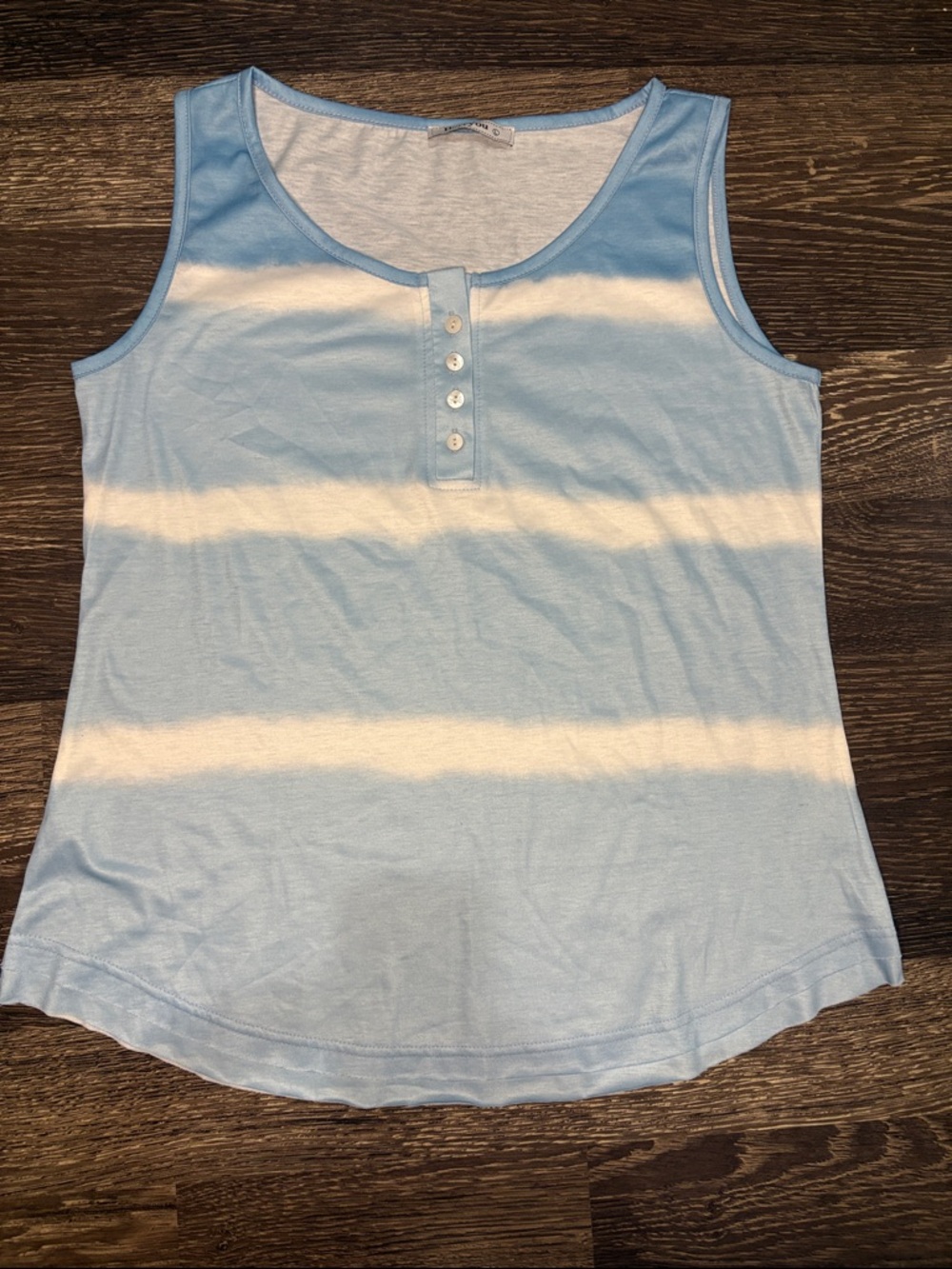 Woman’s light blue and white tank top size large